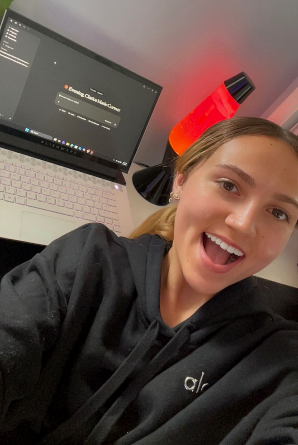 Clarice beaming at her Alienware laptop after setting up her 2nd Brain